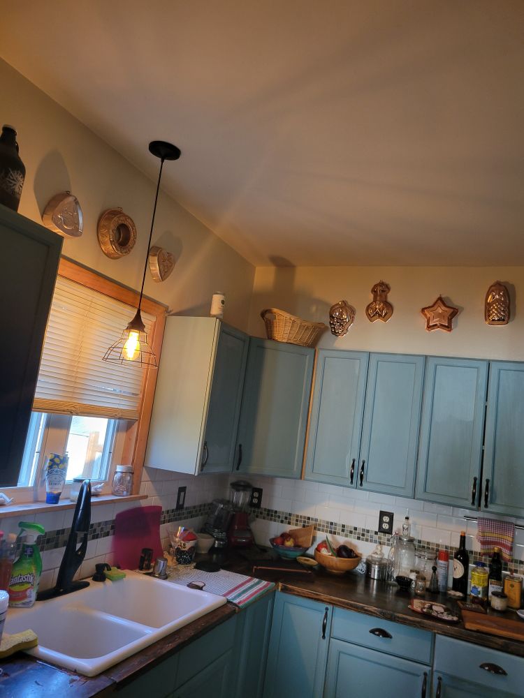 Copper molds and white kitchen sink