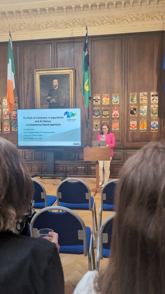 A woman speaking from a lectern