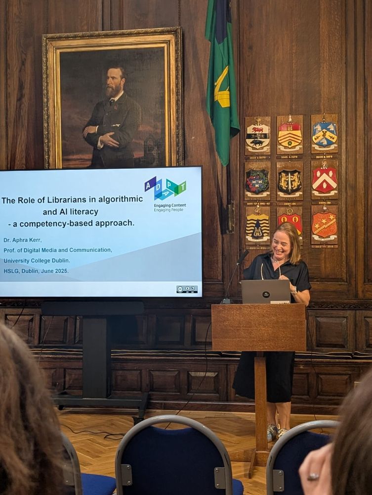 A woman speaking from a lectern