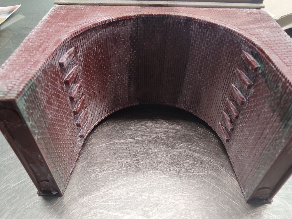 Underside view with green to signify water damage and black for soot 