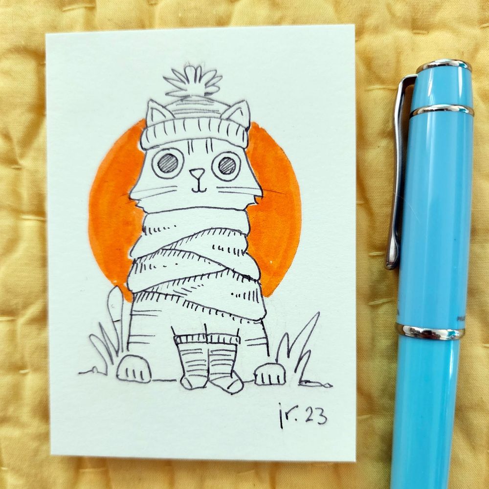 Pen and ink drawing of a happy cat wearing a huge scarf, a hat with a pompom, and socks on its front paws.