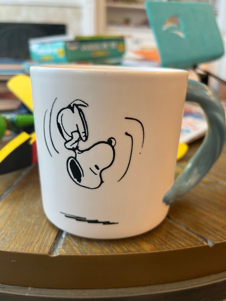 Snoopy upside down on a coffee mug