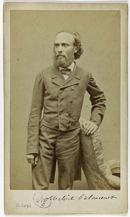 Bearded man in suit and tie