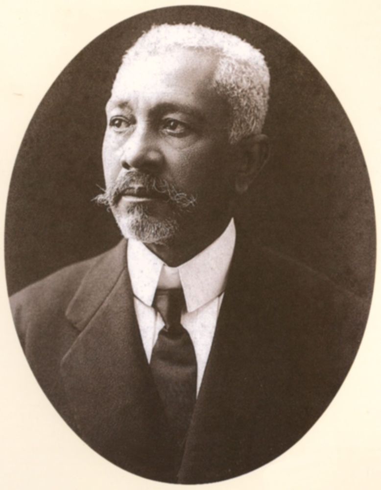 Portrait of a man with a beard and mustache in coat and tie