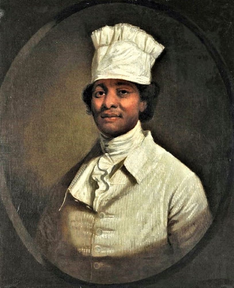Man in a white coat, cravat, & hat. The subject’s hat, which was once mistaken for the tall chef’s toque that emerged in the 1820s, is similar to the style depicted in “Free West Indian Dominicans” made by Agostino Brunias c. 1770.