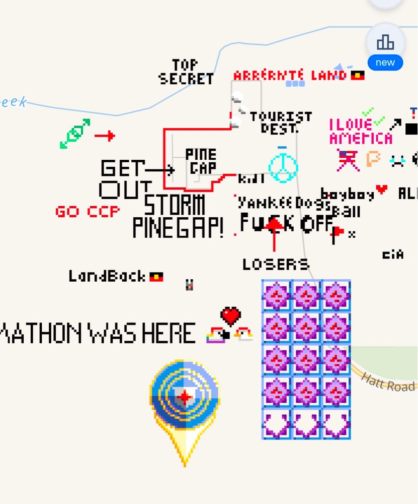 Wplace screenshot of the actual pinegap location, showing text telling the Americans to fuck off and storm the place