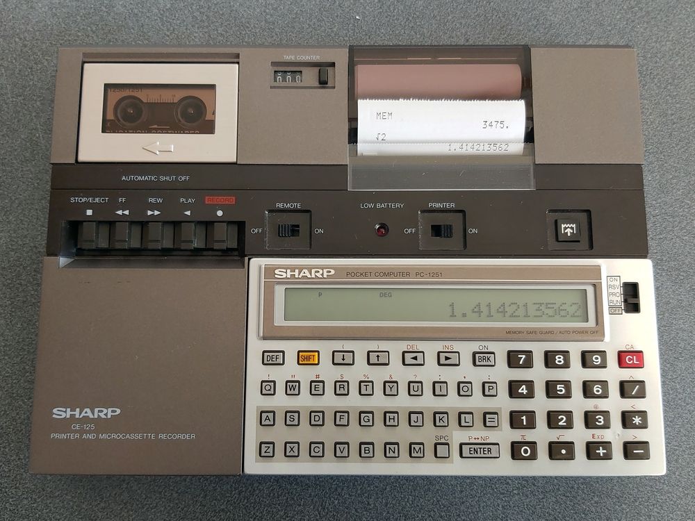 Photo of a Sharp PC-1251 pocket computer connected to a CE-125 printer and microcassette recorder.