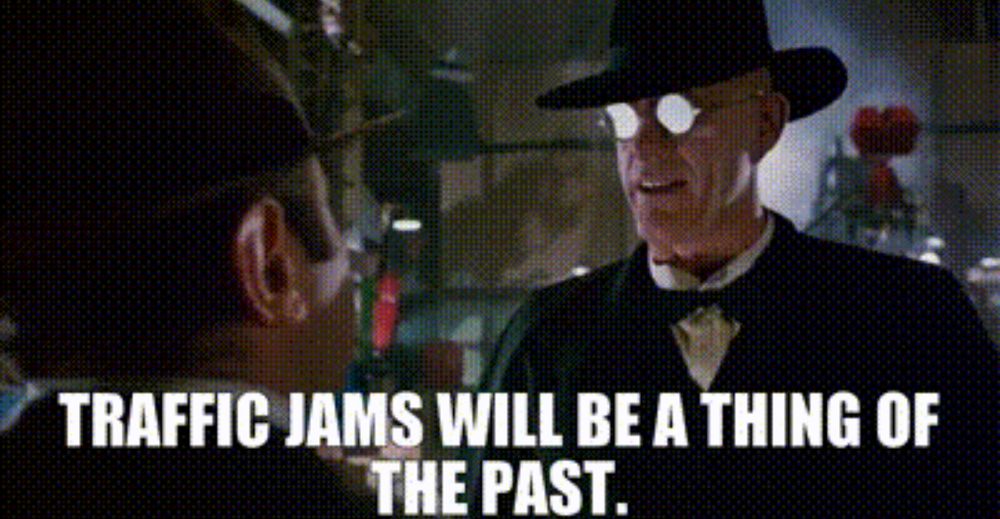 Still from Roger Rabbit: the murderously carbrained Judge Doom smiles like a jackal beneath anime glasses. He says: “traffic jams will be a thing of the past.”