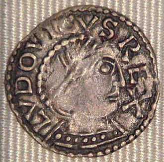 A denier (obverse) from the reign of Louis IV minted at Chinon. The king's head is seen in profile looking right. The inscription around the border reads LUDOVICUS REX.