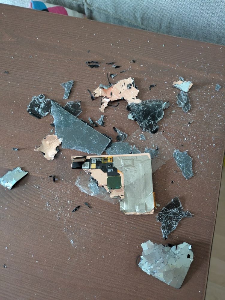 A completely destroyed pixel 7a phone display on a table