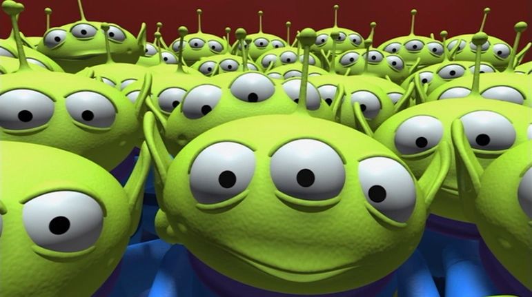 The aliens from “Toy Story,” inside the claw machine and staring with their three eyes each directly at the camera.