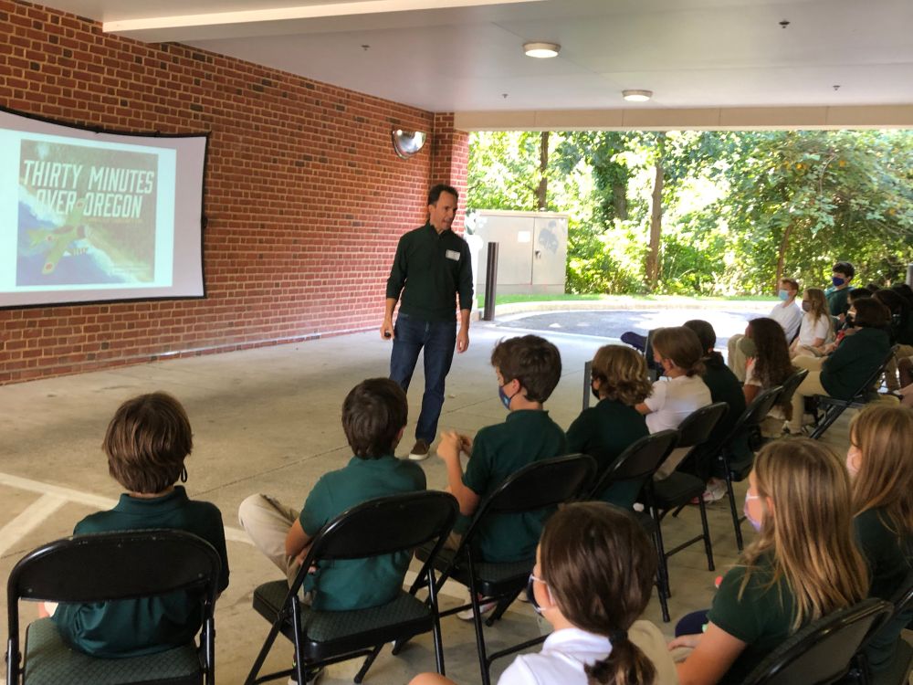 author Marc Tyler Nobleman presenting to kids outside