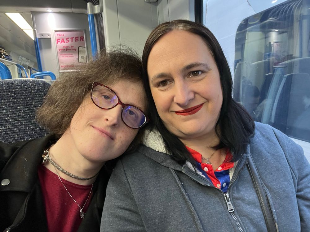 Two of them there trans women on a public transportation device; a train!