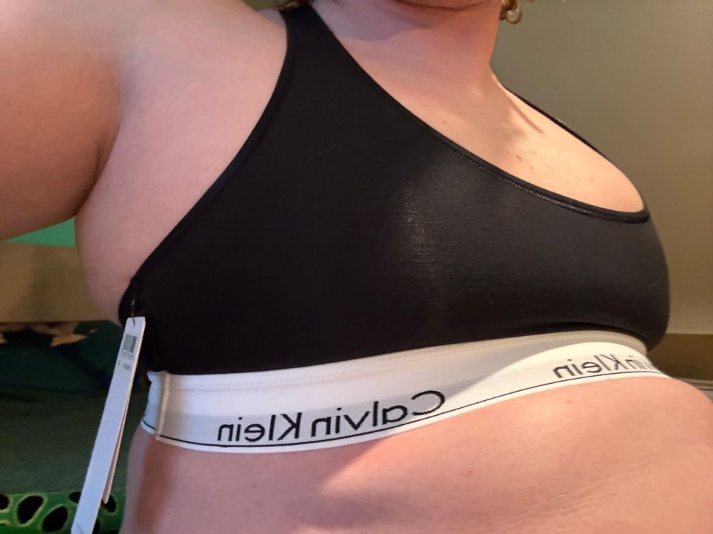 A girl in a Calvin Klein sports bra 