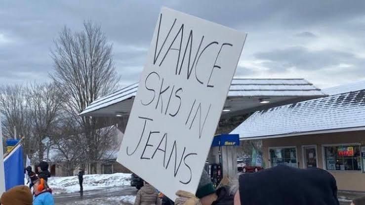 Another Vermont protestor holding another "VANCE SKIS IN JEANS" sign