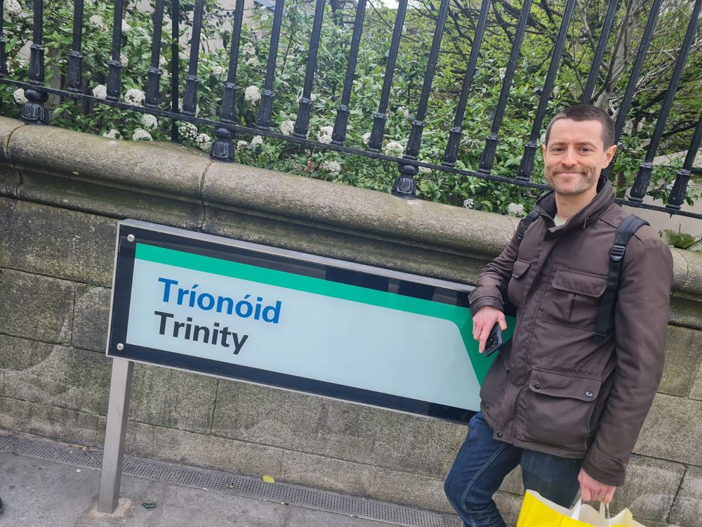 Me by a big sign that says 'Trinity'