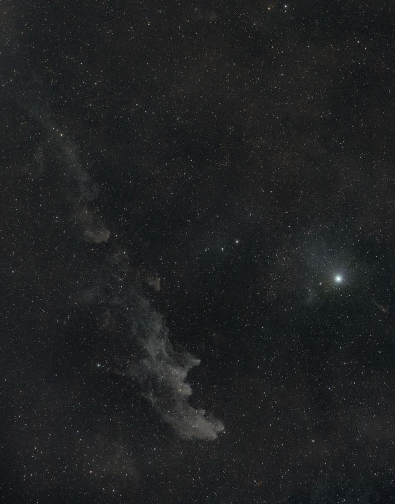 A cropped version of the first image. This features the witch head nebula to the center-left and Rigel to the right of the frame. 