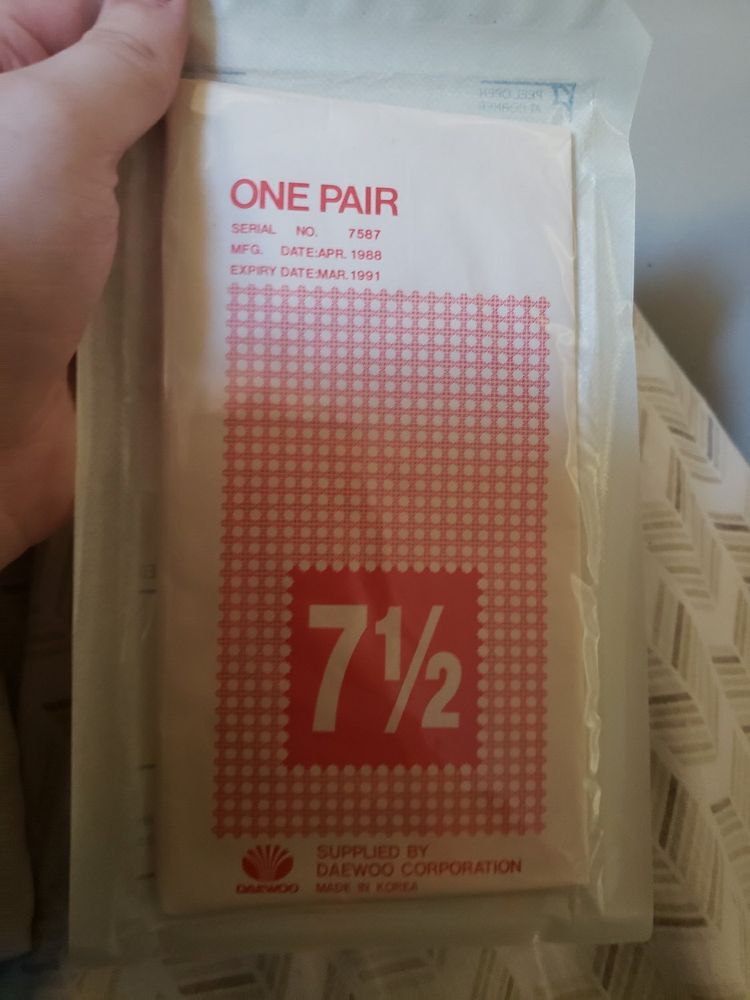 The back of a packahe of sterile latex surgical gloves. The manufacture date is April 1988, expires March of 1991.