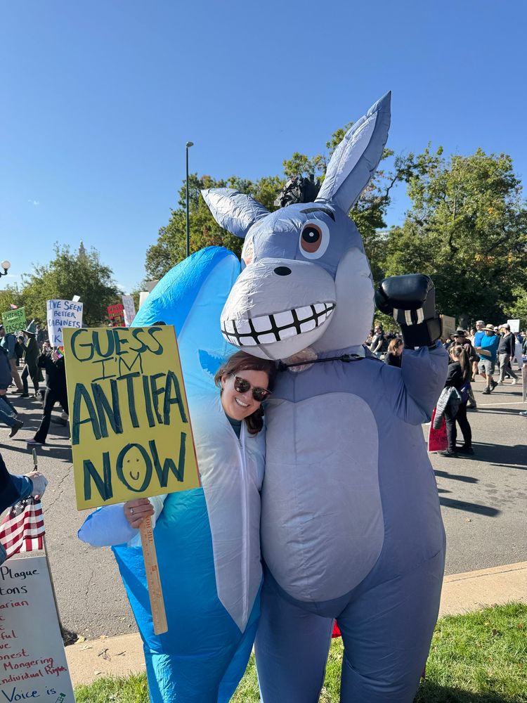 Protestors in baby shark and donkey costumes 
