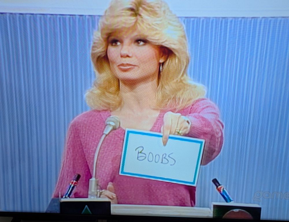 Loni Anderson presenting her answer, Boobs, to a question on Match Game. 