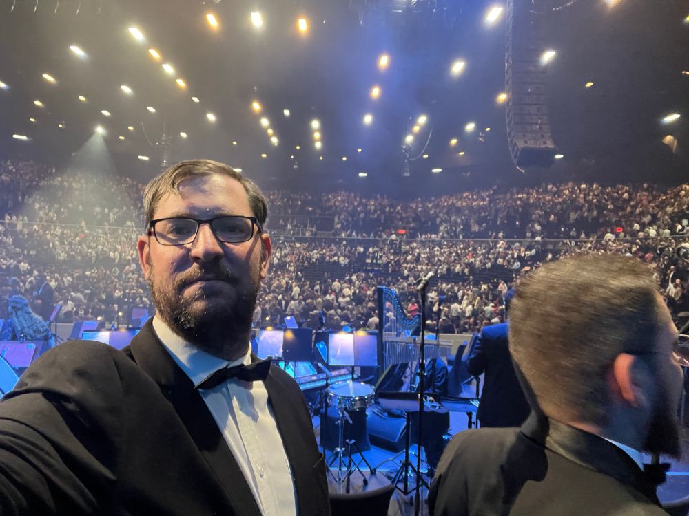 A selfie from the stage of an Andrea Bocelli concert facing out towards the audience.