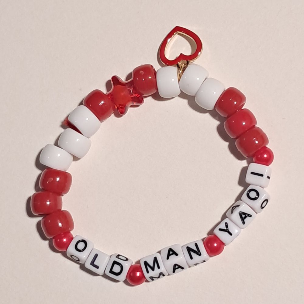 red and white 'old man yaoi' bracelet'