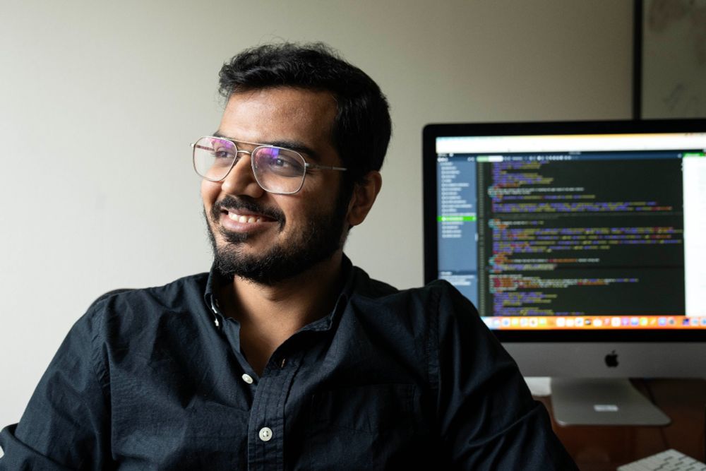 SMU faculty member Digvijay Boob poses with computer. The engineering professor was awarded a five-year CAREER grant to pioneer quicker, streamlined solutions that could speed up how AI learns from data to make predictions and decisions.