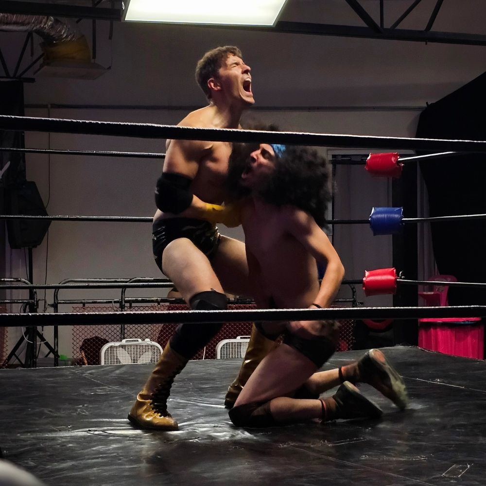 James Angel cries out from a hit to the abdomen. 