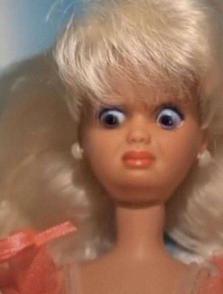 Barbie face with a mixture of horror and surprise 