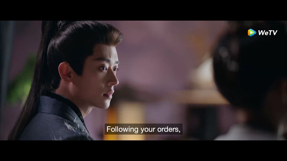 Xiao Jue, looking gorgeous in long hair and robes, is gazing at He Yan while trying to look at General like as they discuss strategy....as Generals....