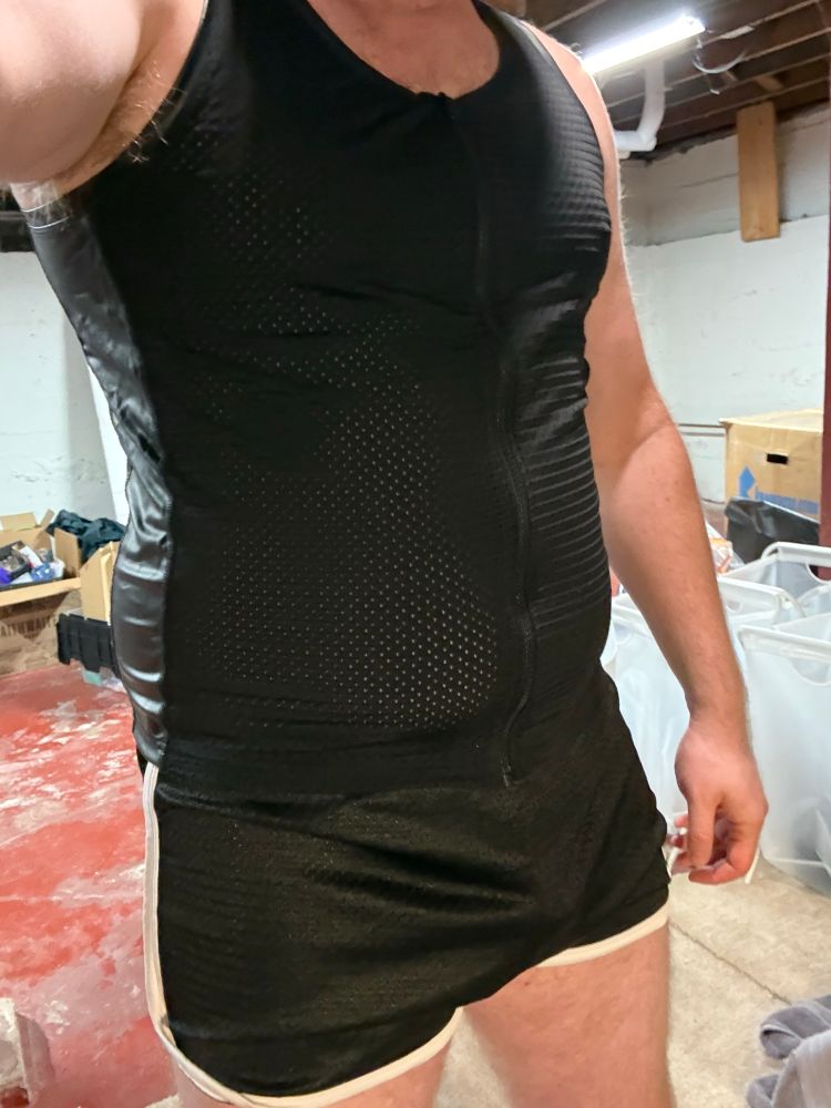 Man in a mesh shirt and mesh shorts. 