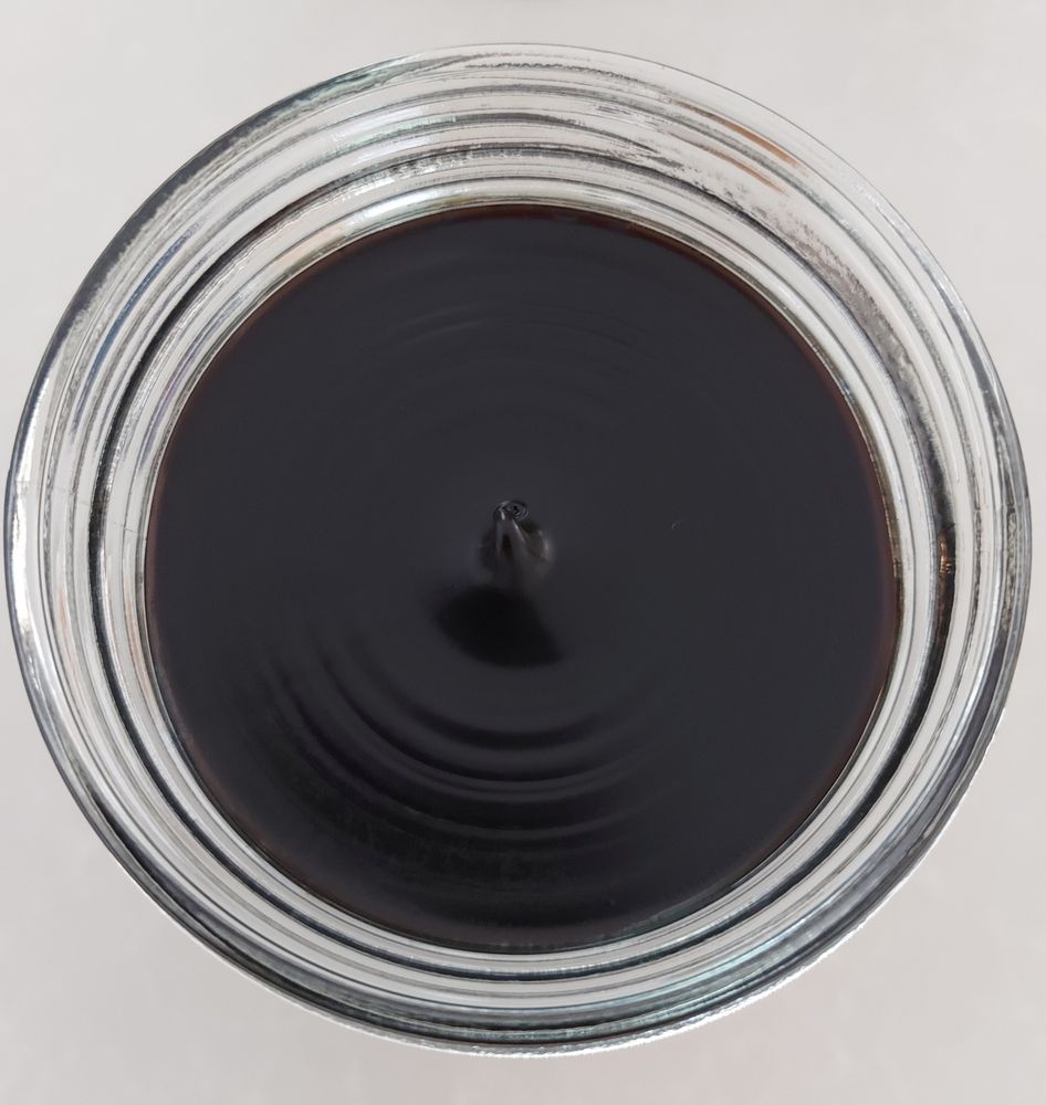 New jar of Vegemite, opened, viewed from above. 