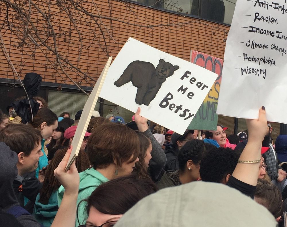 From the Atlanta Women’s March: a sign held up with a drawing of a bear that says, “Fear Me Betsy.” 