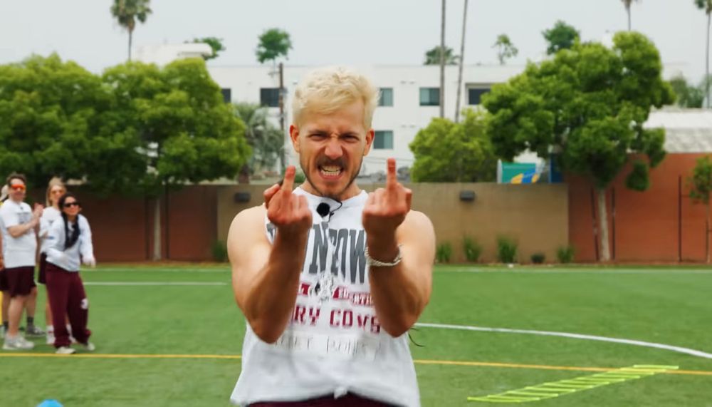 Tommy flipping off the camera after he does his Summer Games sprint.