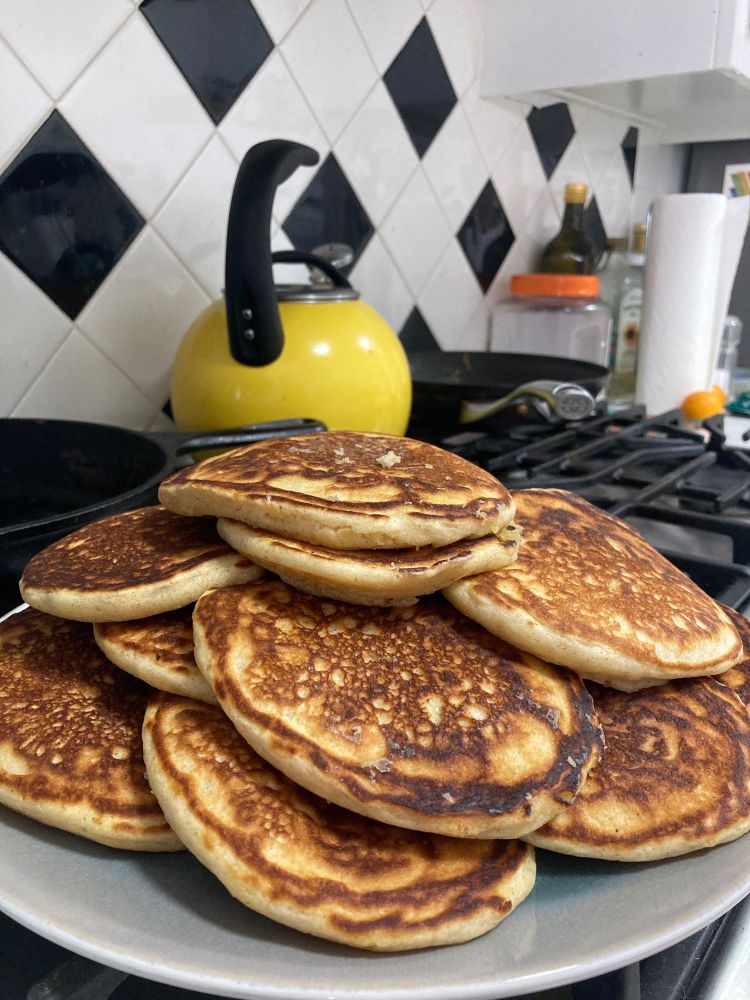 A stack of (perfectly flipped and evenly cooked) pancakes. Arguably too many pancakes.