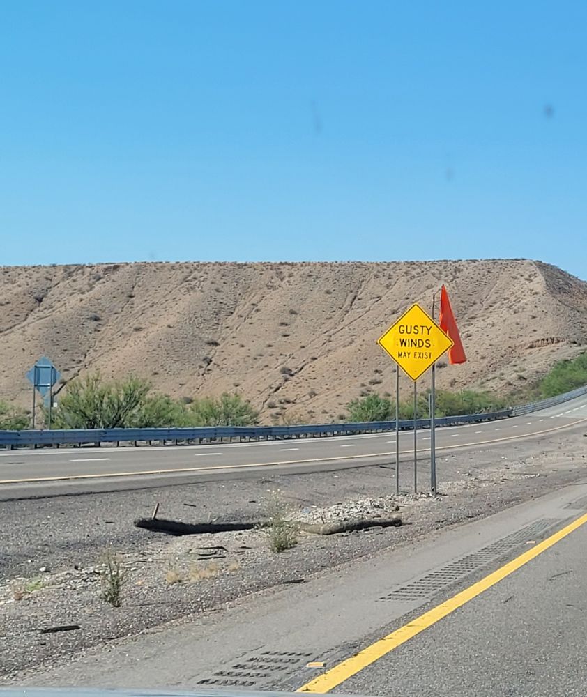 Highway sign in New Mexico letting you know that gusty winds may exist