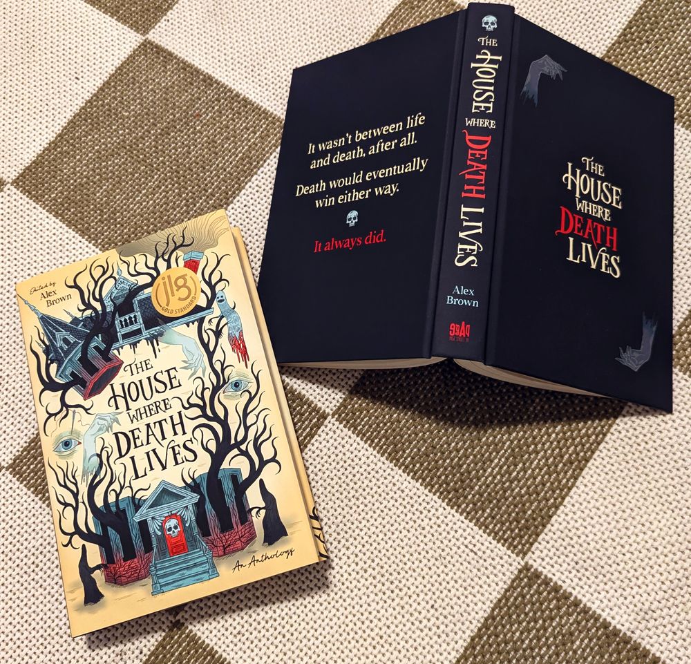 two copies of THE HOUSE WHERE DEATH LIVES, one with the cover and one without the cover