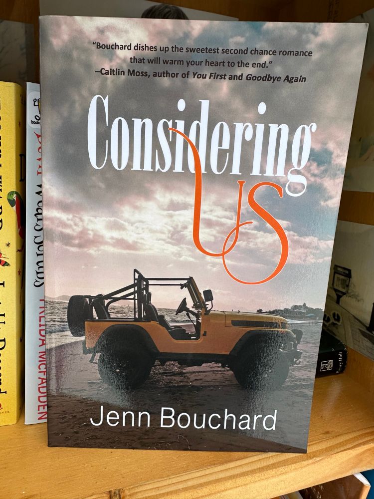 Photo of Considering Us by author Jenn Bouchard book inside a little free library.