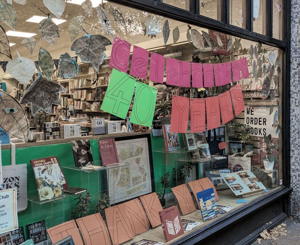 A photo of the window display at Beckenham Books, with the sign 'celebrating 40 years'