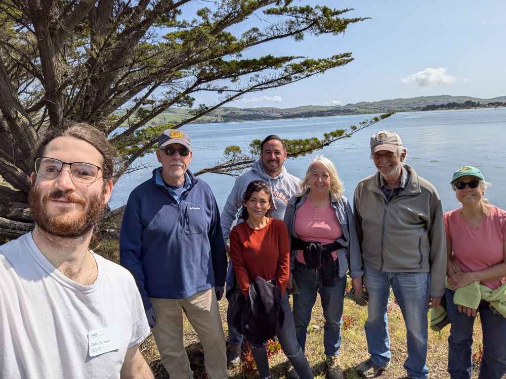 A group of volunteers gathered around for a selfie with Zeke Spooner.