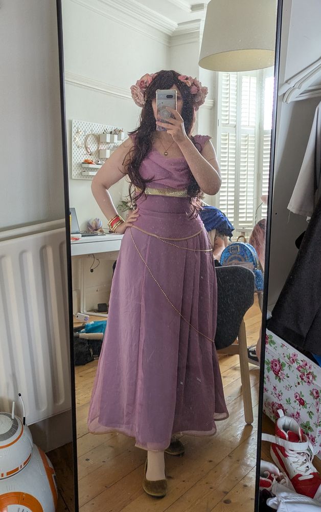 theStarlightFairy cosplaying as Circe, in an ankle length dress with gold details