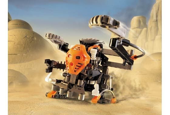 A picture of a Lego Bionicle set in a desert scene; depicting a strange mechsuit-like vehicle being driven by a small humanoid Matoran character at the front.