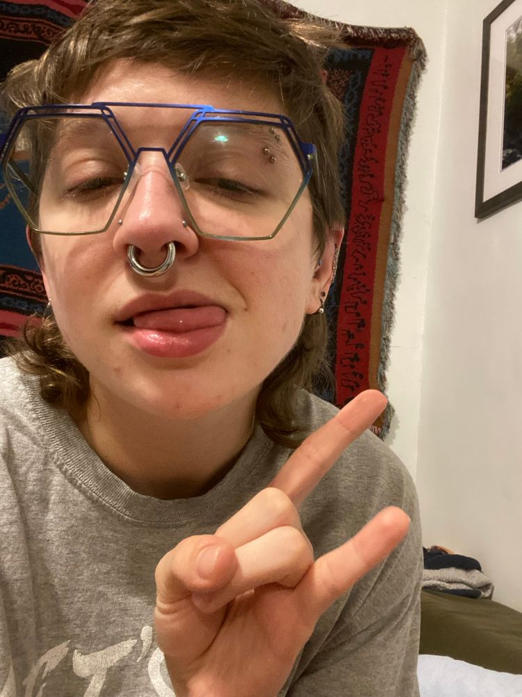 selfie showing off a 6g septum piercing