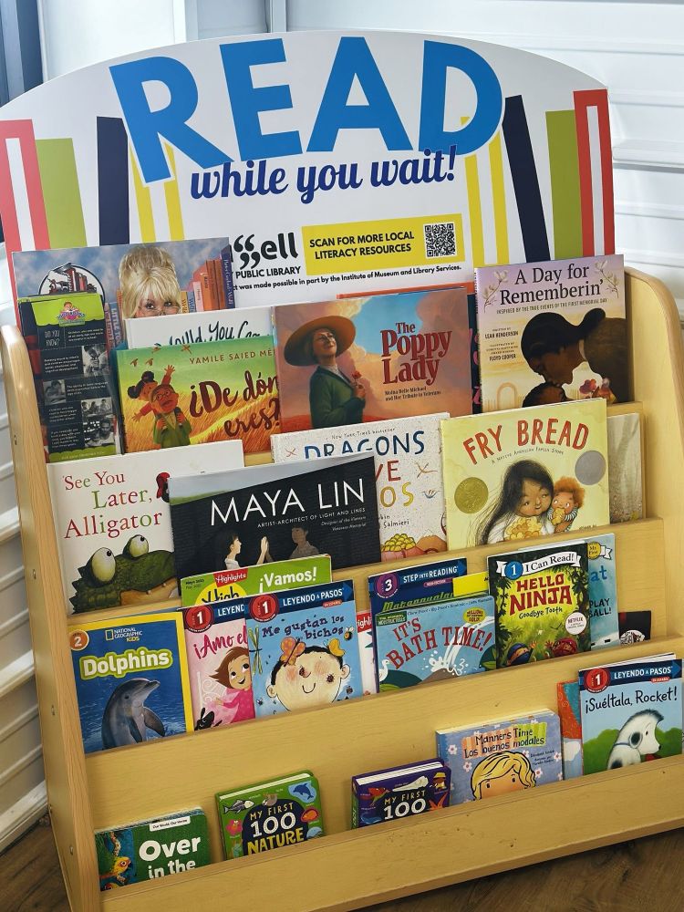 The Read While You Wait display at Laker Laundry by Russell County Public Library.
