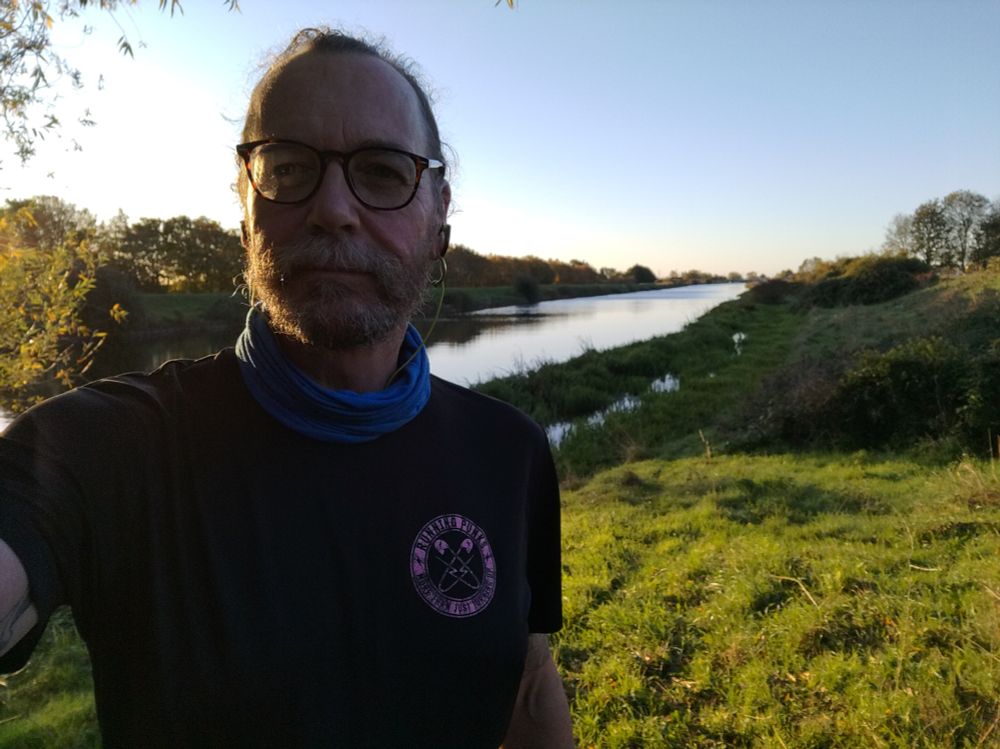 Idiot on river bank in the early morning sun