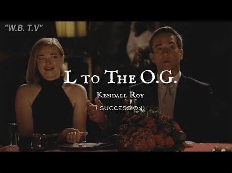 A still shot from the TV show Succession showing Shiv Roy and Tom Wambsgans reacting with surprise and discomfort to Kendall Roy performing a song called L to the OG, a tribute to Logan Roy