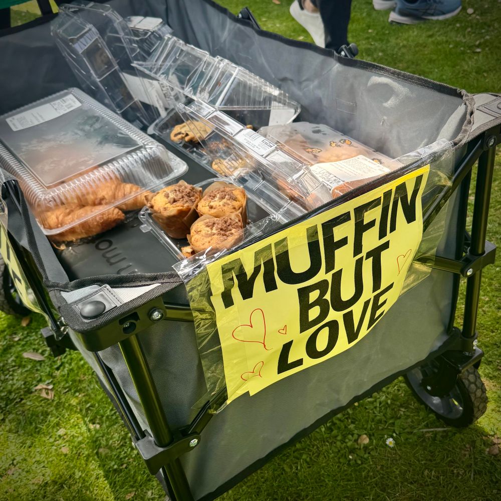 One protester brought a wagon full of baked goods to share with everyone. Sign reads “Muffin but love”
