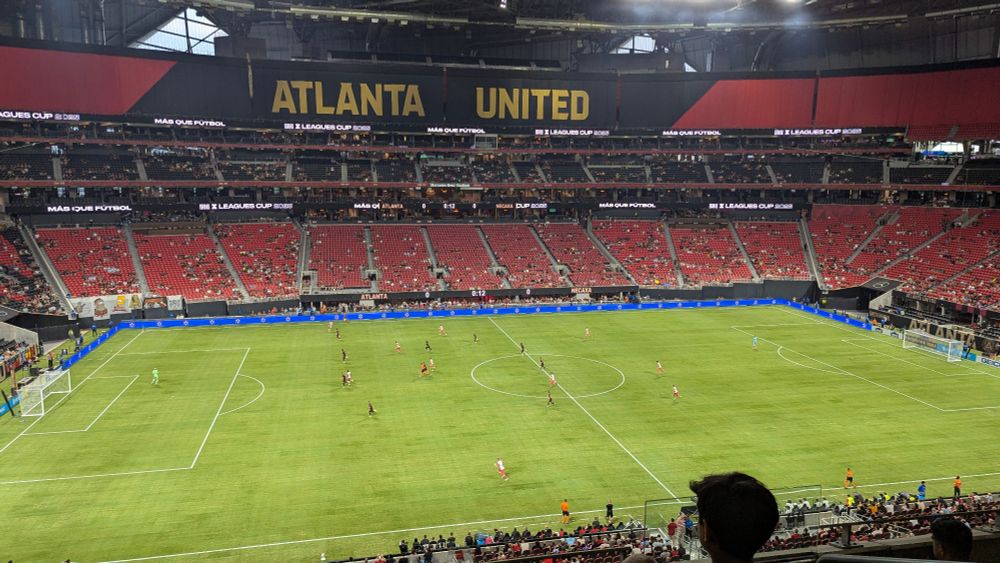 Atlanta United vs Necaxa in a mostly empty Mercedes-Benz Stadium but there is a grass pitch instead of the normal turf. (Installed for Premier League preseason games this weekend)