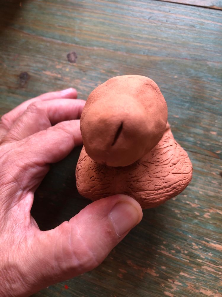 Terracotta sculpture of a male dick
