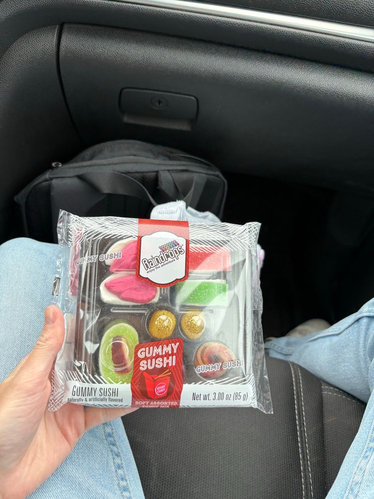 a container with gummy candy sushi, sashimi, and other various gummy candy pieces